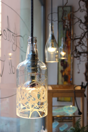 Lampada in vetro riciclato realizzata a mano personalizzabile artigianato ticinese neeDesign